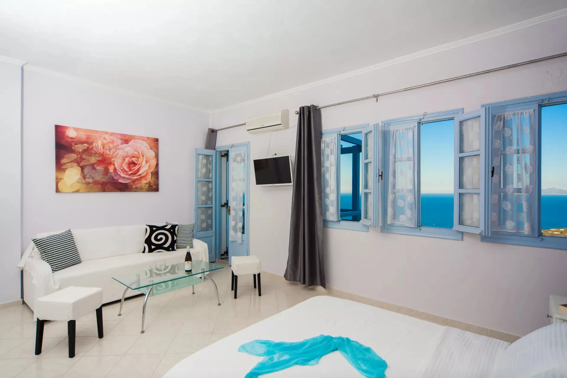 Superior studio interior with balcony access