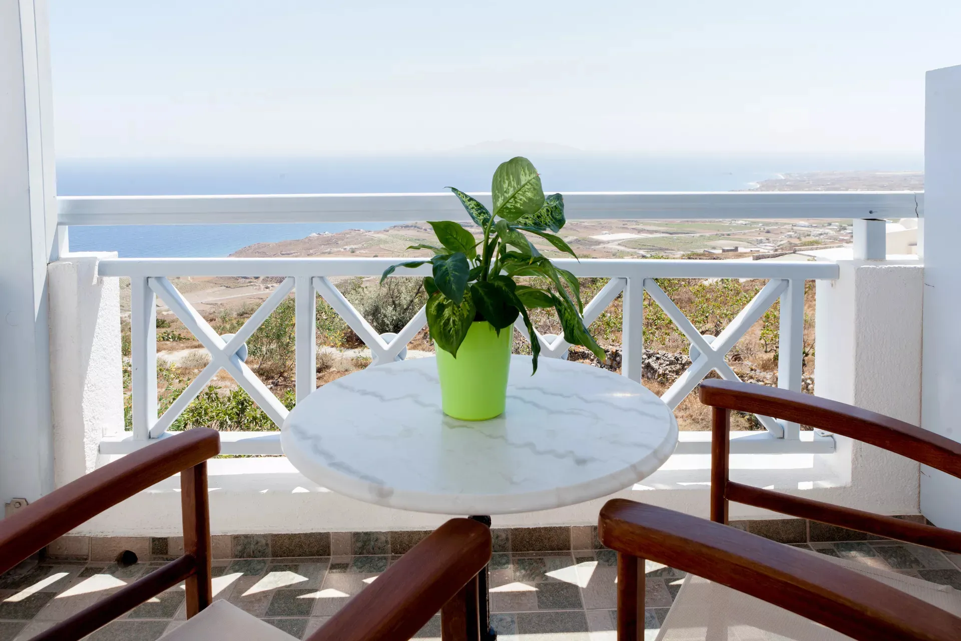 Balcony seating overlooking the Aegean
